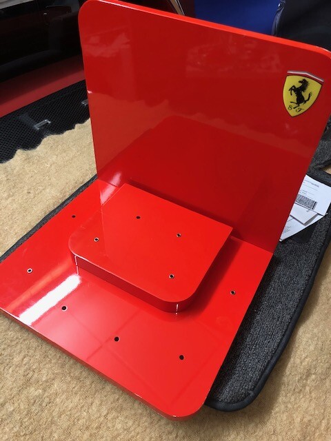 Ferrari Dealer Watch display with Extra Dealer sign and a Lamborghini sign