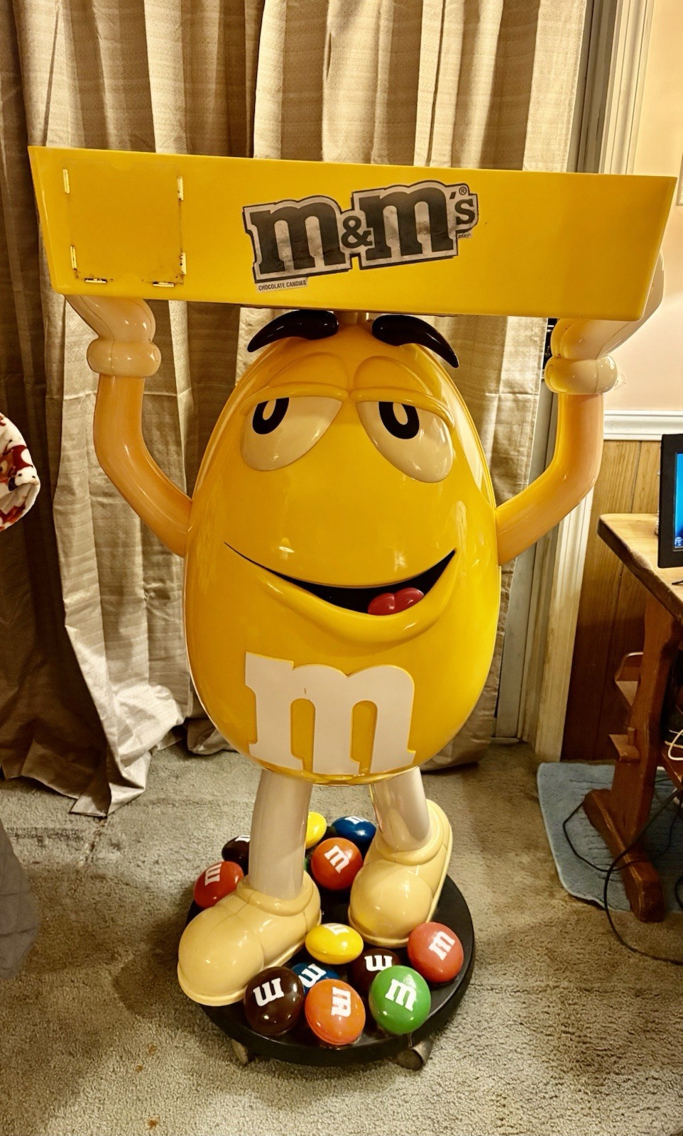 Yellow M&M Display With Tray On Wheels 45 1/2 Inches