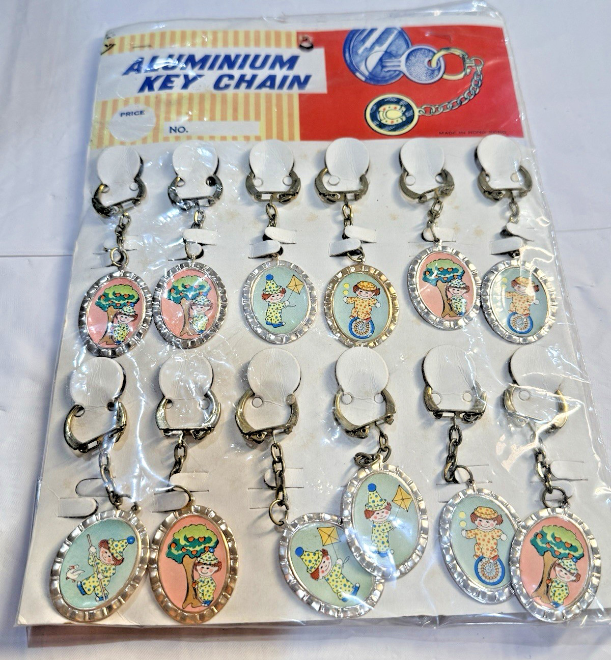 Vtg Novelty Key Chain ALUMINUM Playful Clown Charm Original Display of 12