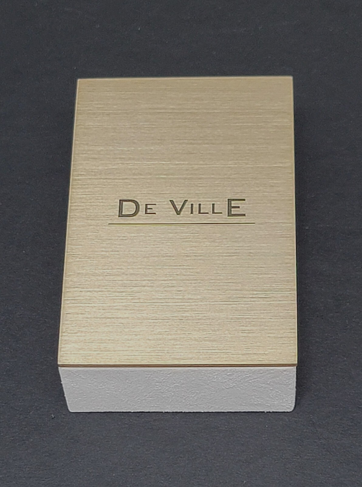 ORIGINAL OMEGA WATCH DEALER’S “DE VILLE” SMALL BRASS AD SIGN