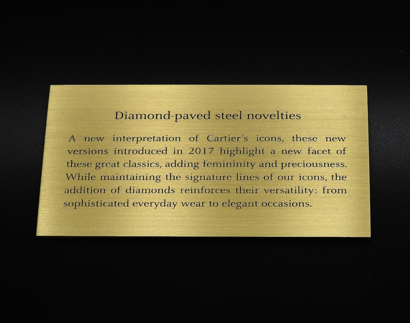 ORIGINAL CARTIER “DIAMOND PAVED STEEL NOVELTIES” DEALER’S BRASS PLAQUE