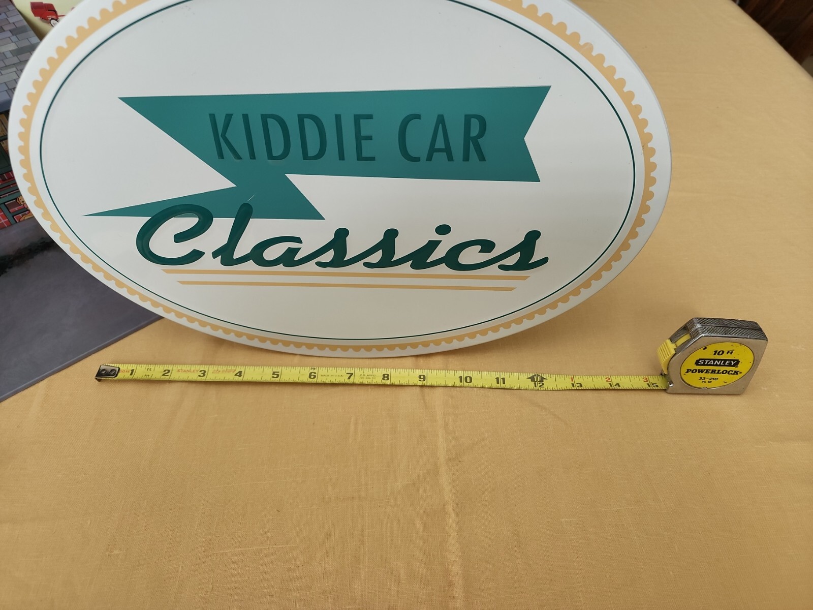 Hallmark Kiddie Car Classics in store display and used garage with street signs.