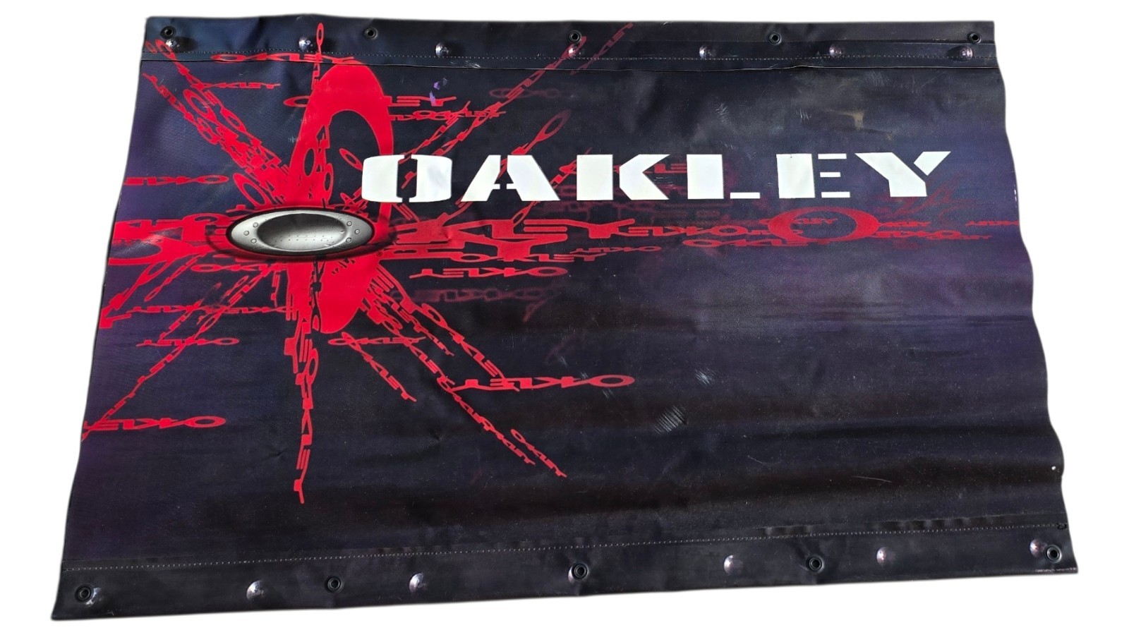 2004 Vinyl Oakley Advertising Banner Sign Two Sided Black & Red 39.75″ x 25.5″