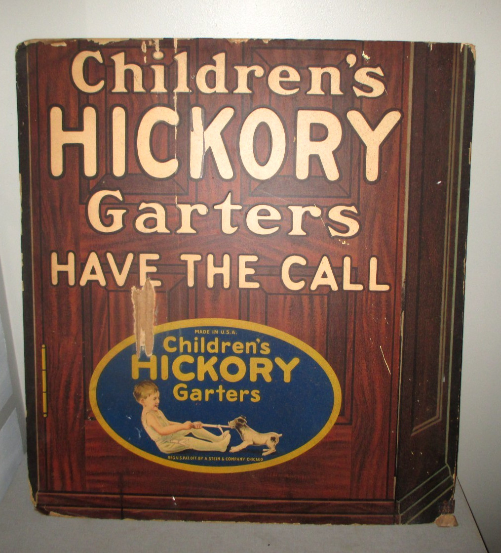 1920’S STORE DISPLAY SIGN-EASEL BACK-CHILDRENS HICKORY GARTERS 32″ CLOTHING