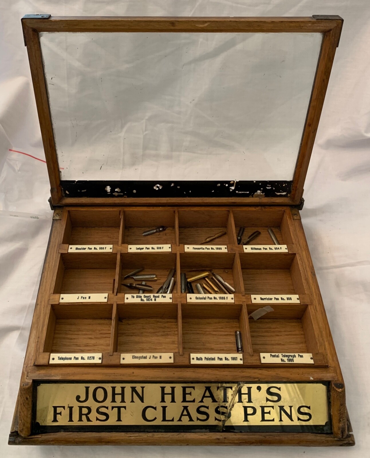 Antique drugstore counter display of John Heath’s First Class Pen Nibs.