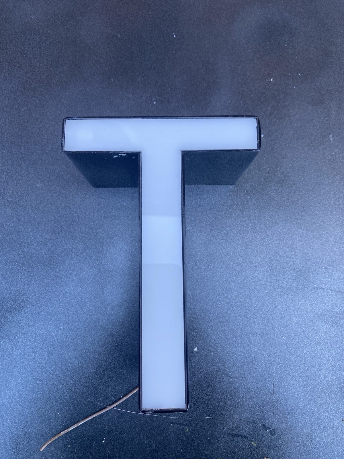 Letter t Ex Sign White Front Black Edge Plex
