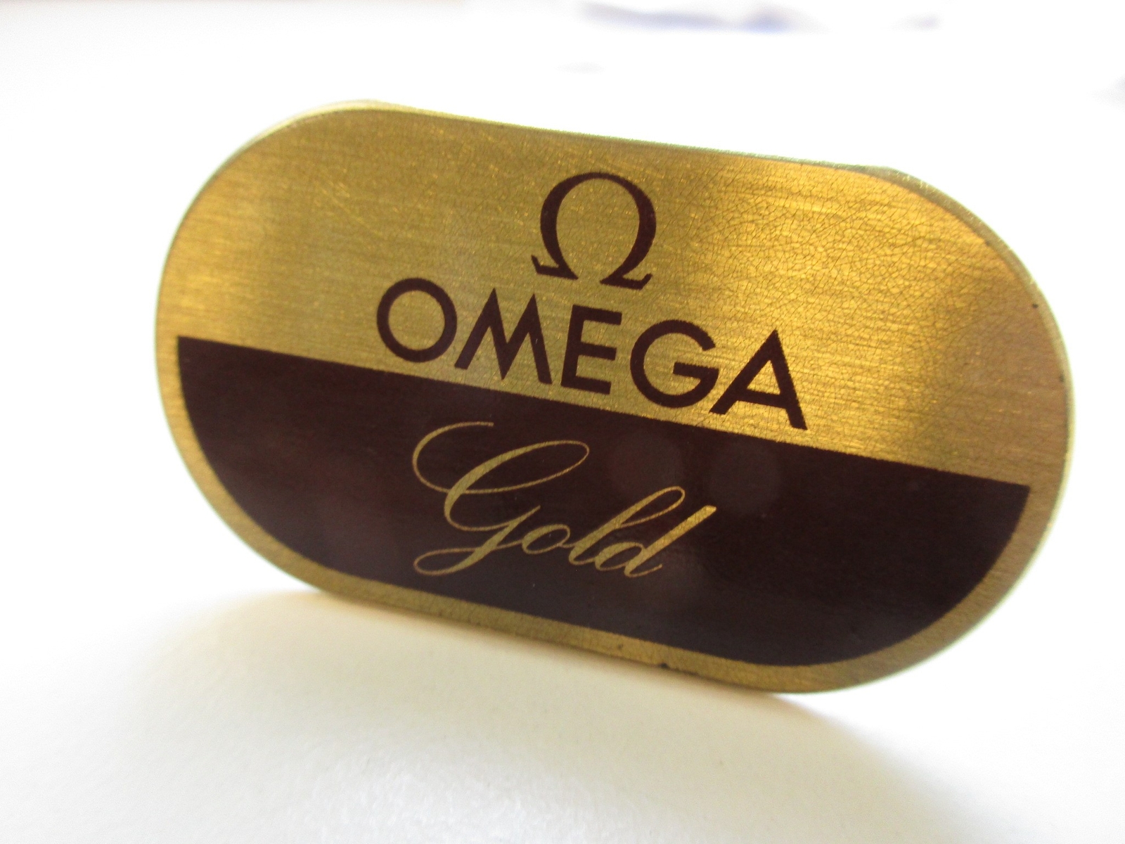 Omega “Gold” vintage brass watch Store display 5.4 x 3.1 mm – made by Ruegg