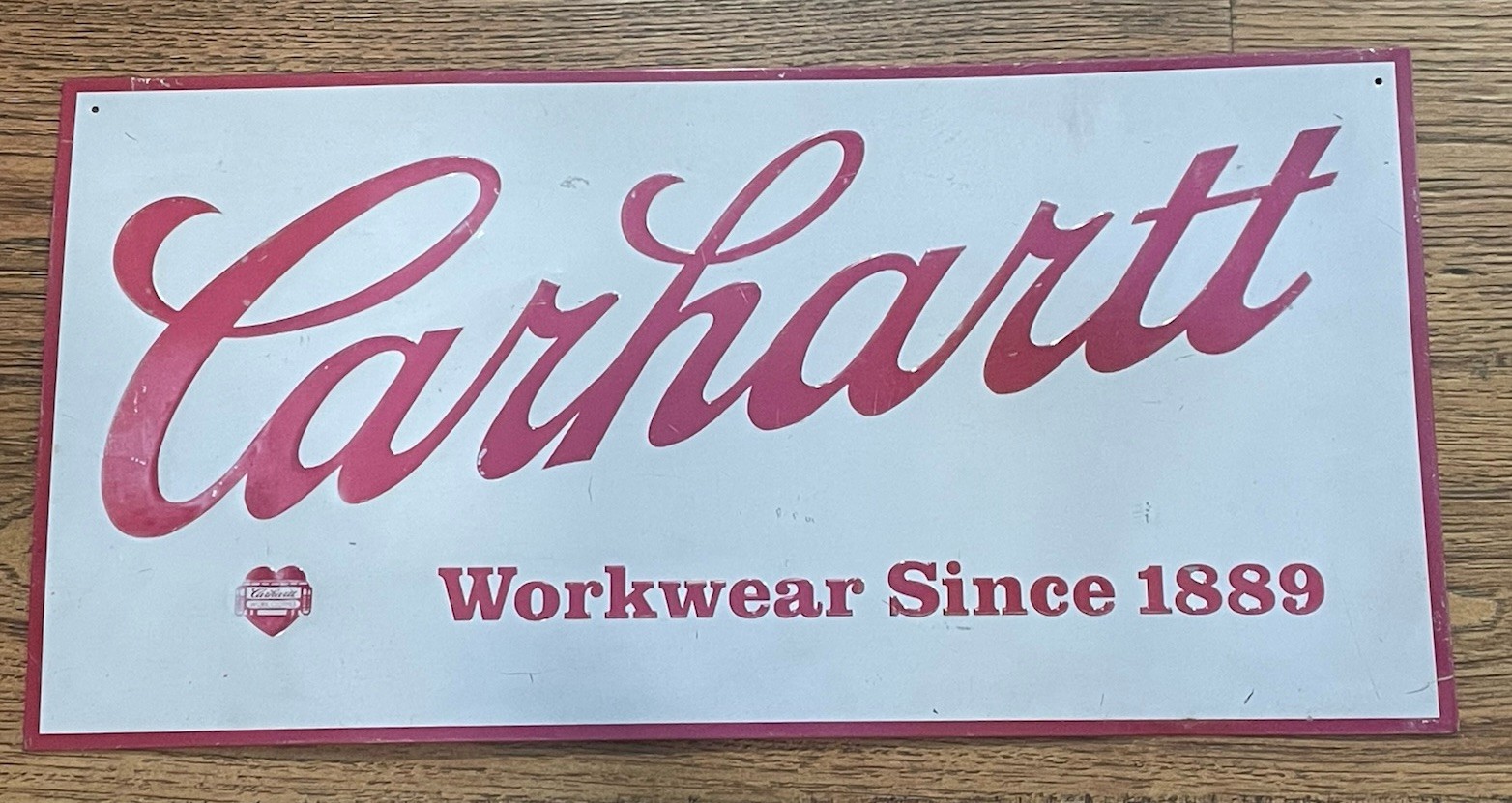 CARHARTT WORKWEAR SINCE 1889 TIN ADVERTISING SIGN EMBOSSED 24″ X 12″