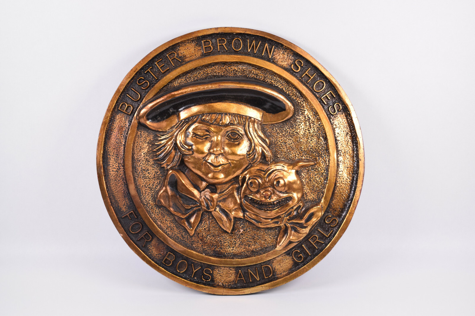 Buster Brown 17 1/2″ Round Store Display Gold/Copper Toned Wall Plaque