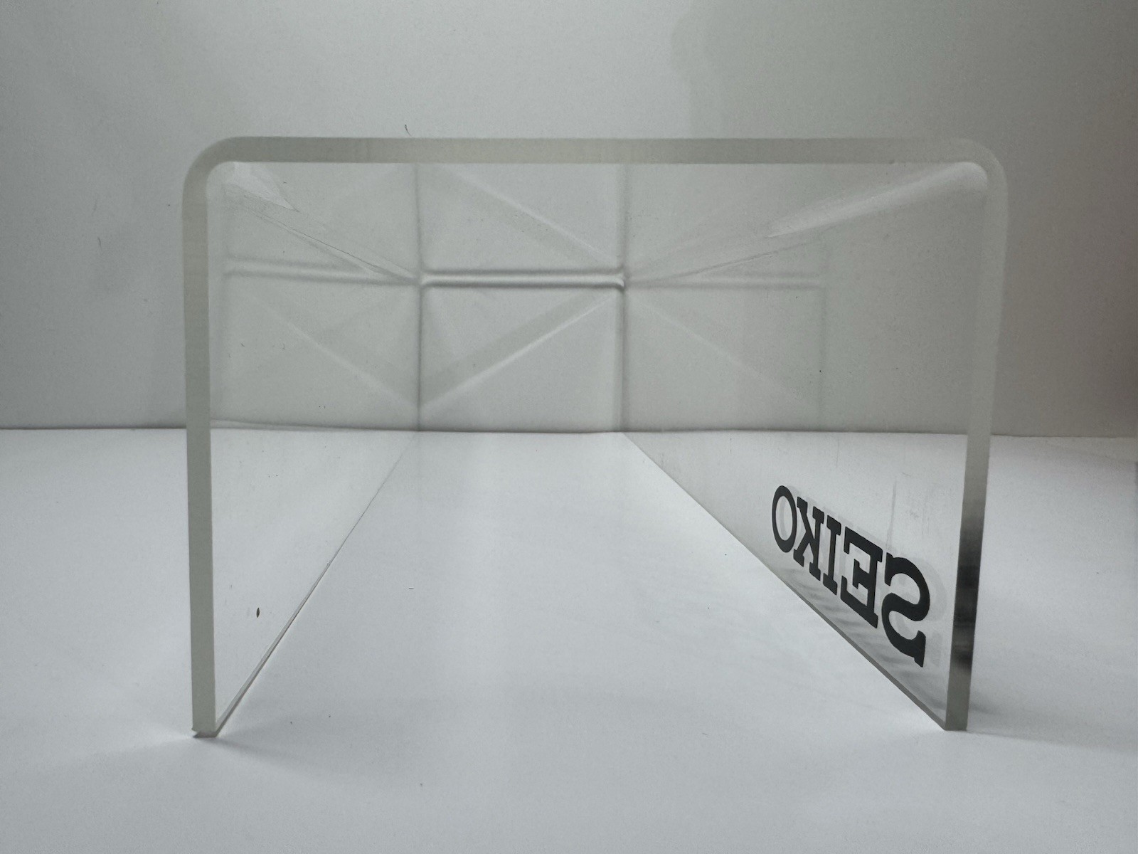 2x clear acrylic Seiko branded display holders