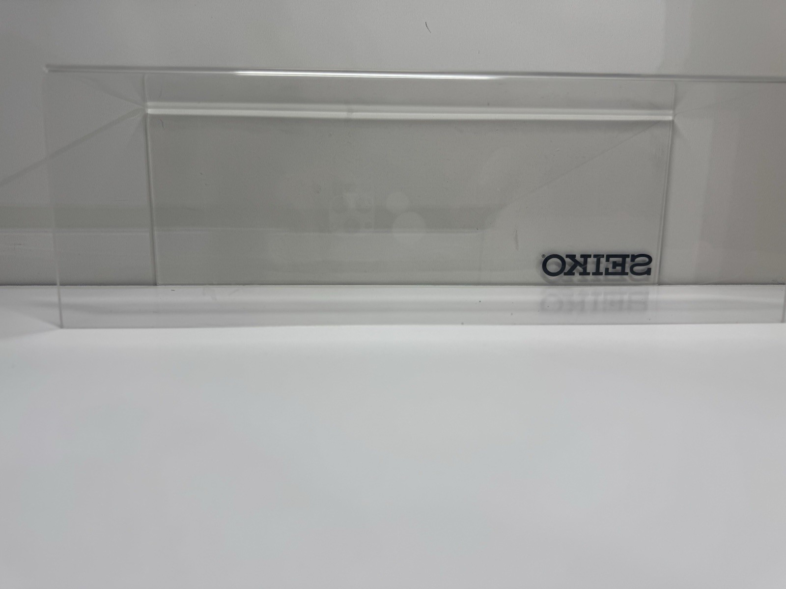2x clear acrylic Seiko branded display holders