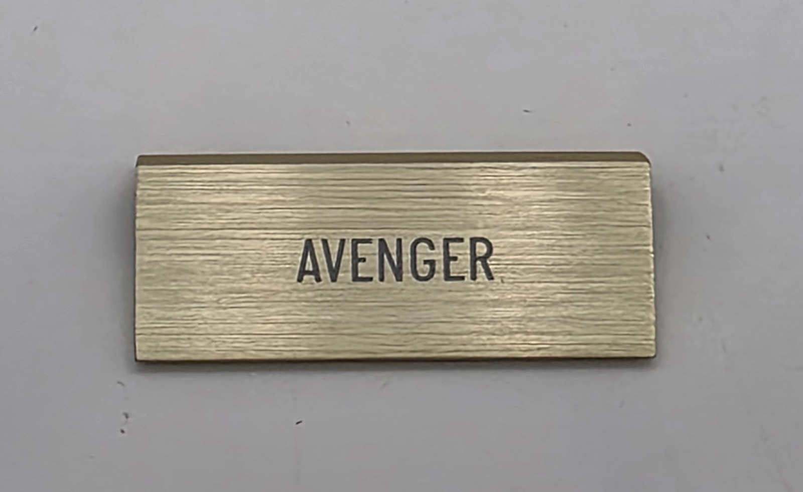 ORIGINAL OMEGA “AVENGER” SMALL DEALER’S BRASS PLAQUE PRE-OWNED