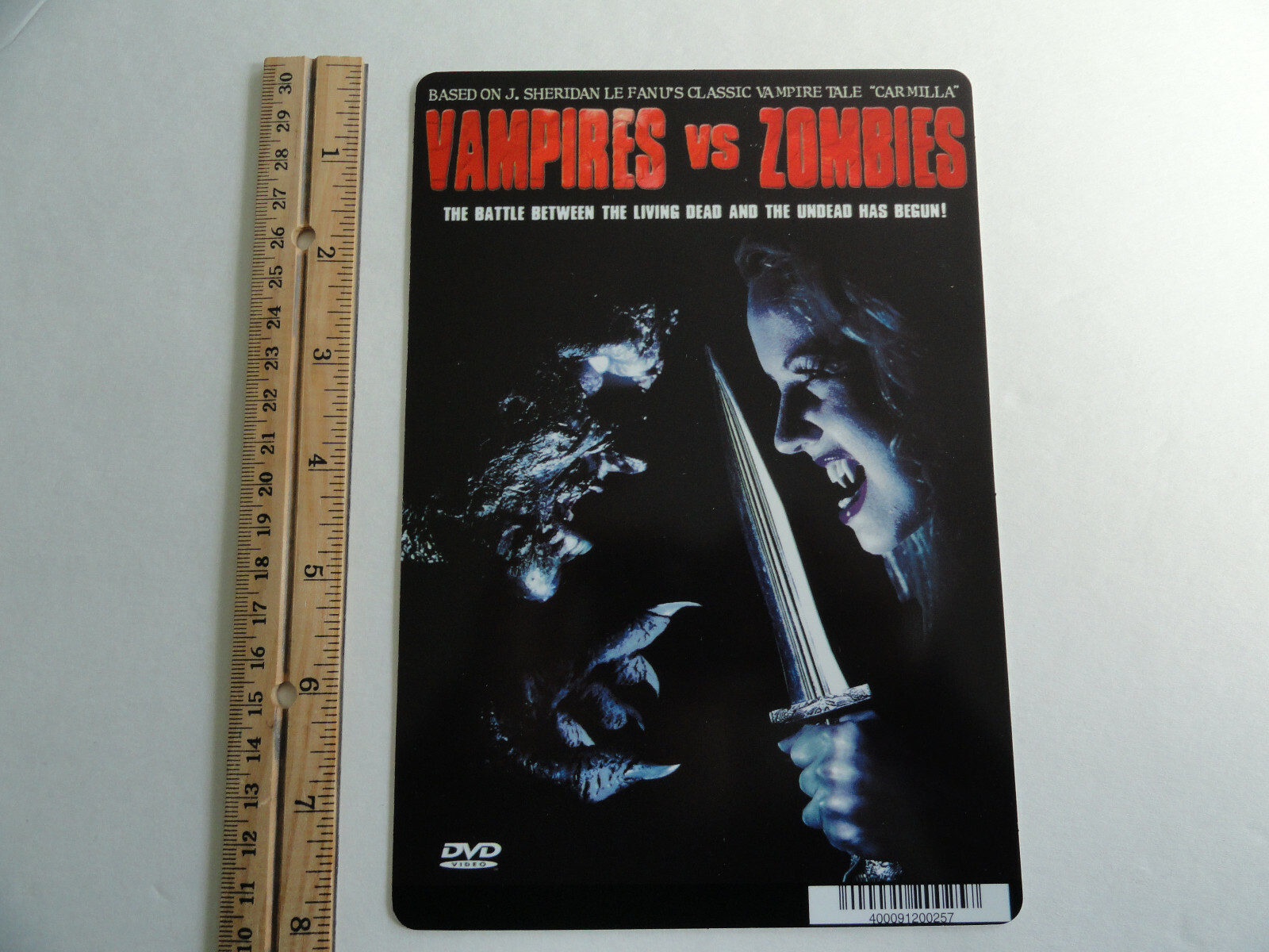 VAMPIRES VS ZOMBIES – J SHERIDAN LE FANU -BLOCKBUSTER BACKER CARD 5″X8″ NO MOVIE