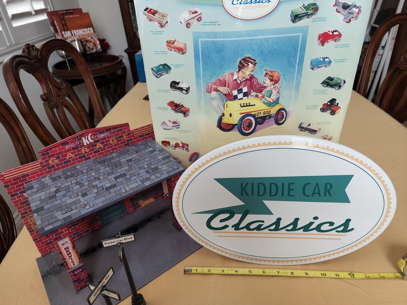 Hallmark Kiddie Car Classics in store display and used garage with street signs.