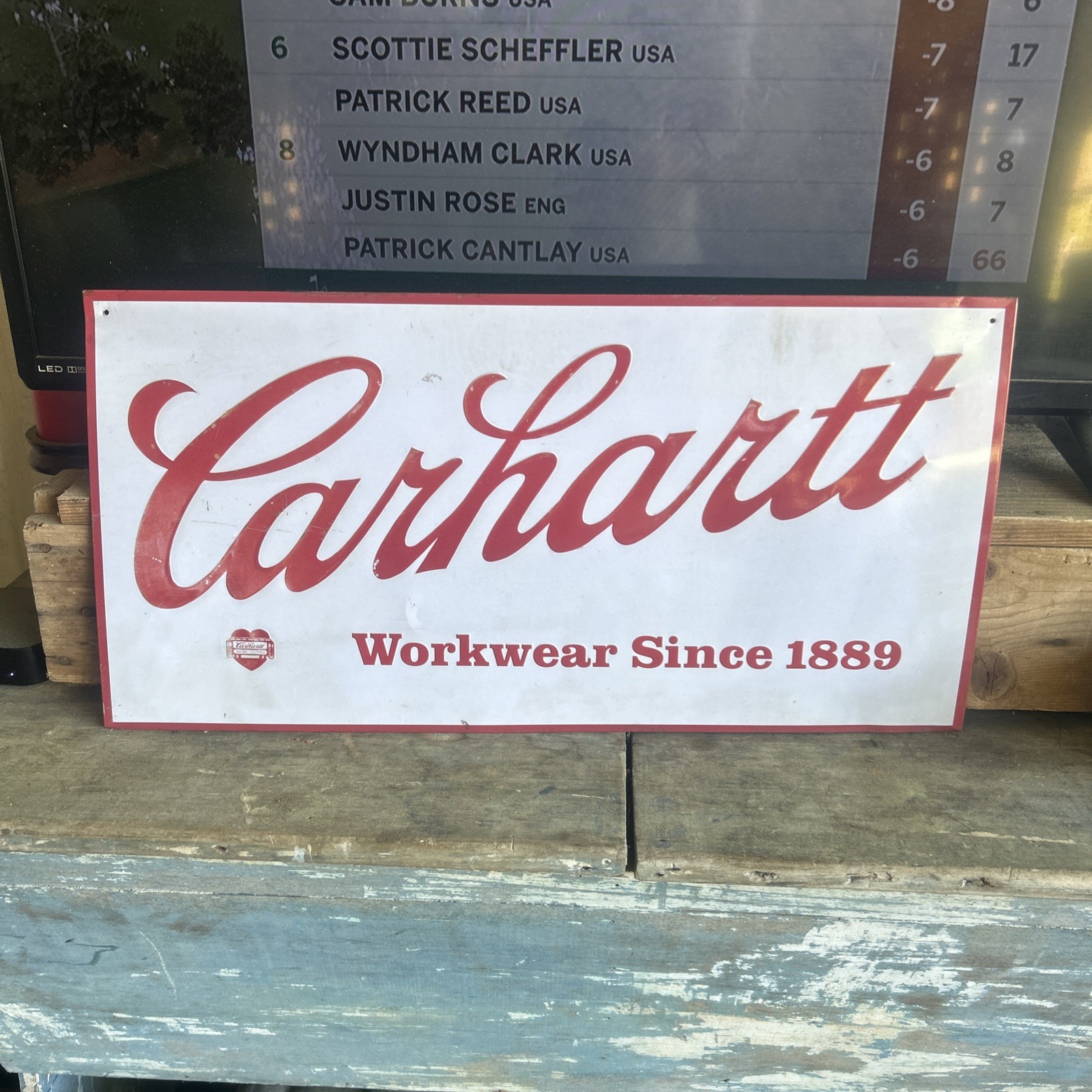 Vtg CARHARTT WORKWEAR SINCE 1889 Metal Tin Sign Advert Embossed 24″x12″ Mancave