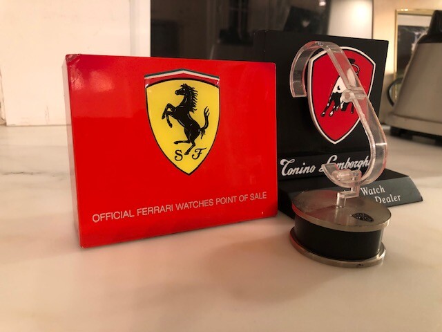 Ferrari Dealer Watch display with Extra Dealer sign and a Lamborghini sign