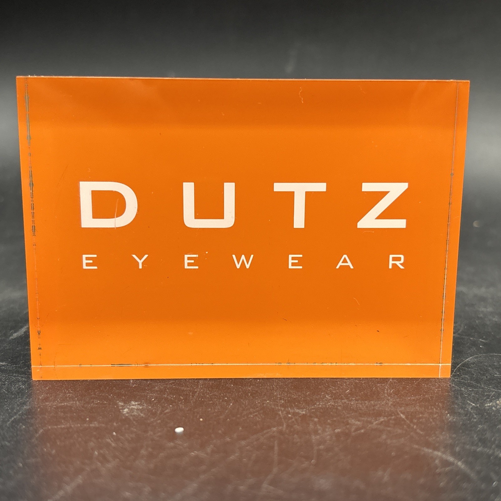 Dutz Eyewear Acrylic Retail Display – Orange Boutique Counter Sign