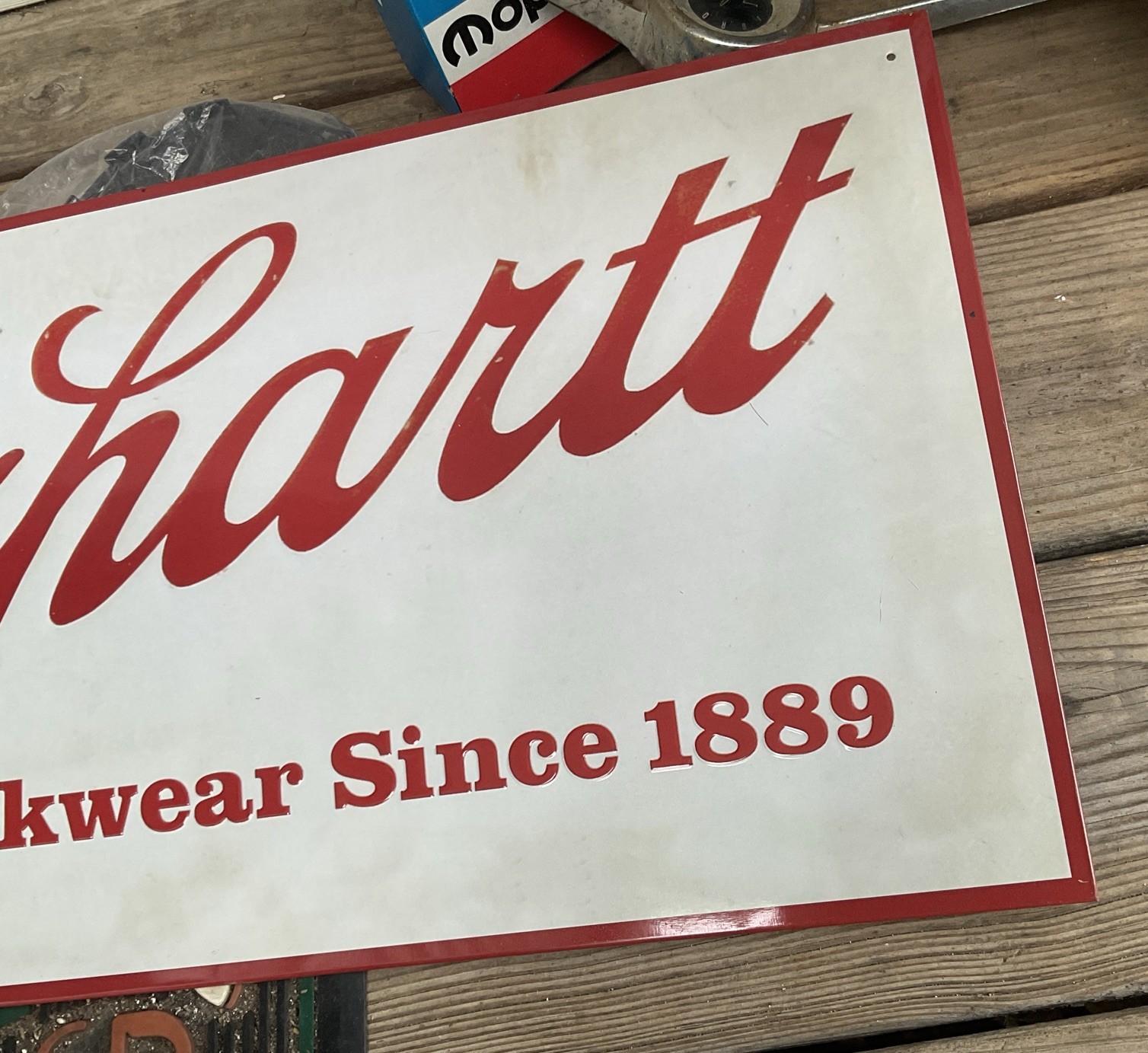 Vtg CARHARTT WORKWEAR SINCE 1889 – Metal Tin Sign Embossed 24″x12″ Mancave