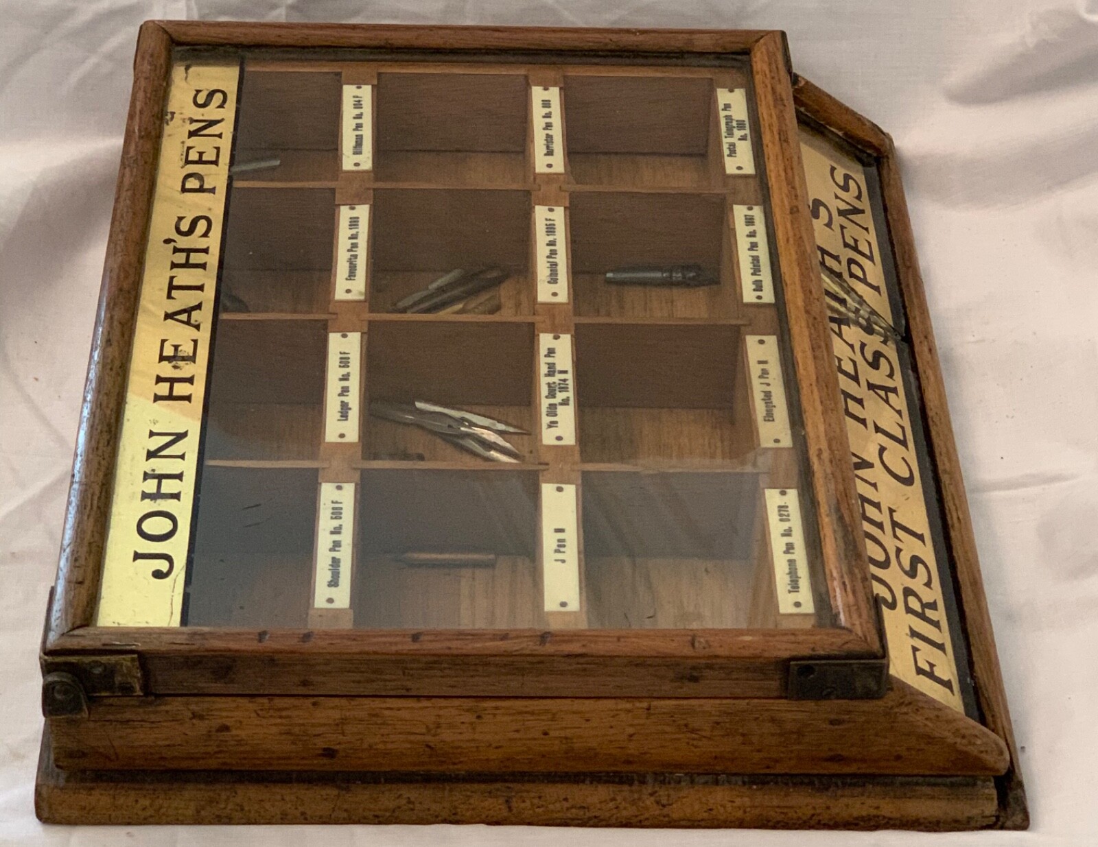 Antique drugstore counter display of John Heath’s First Class Pen Nibs.