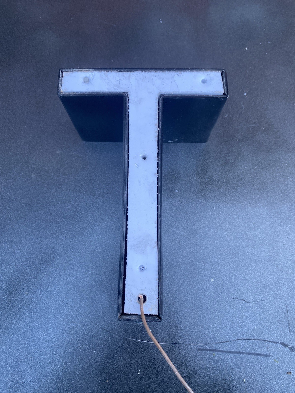 Letter t Ex Sign White Front Black Edge Plex