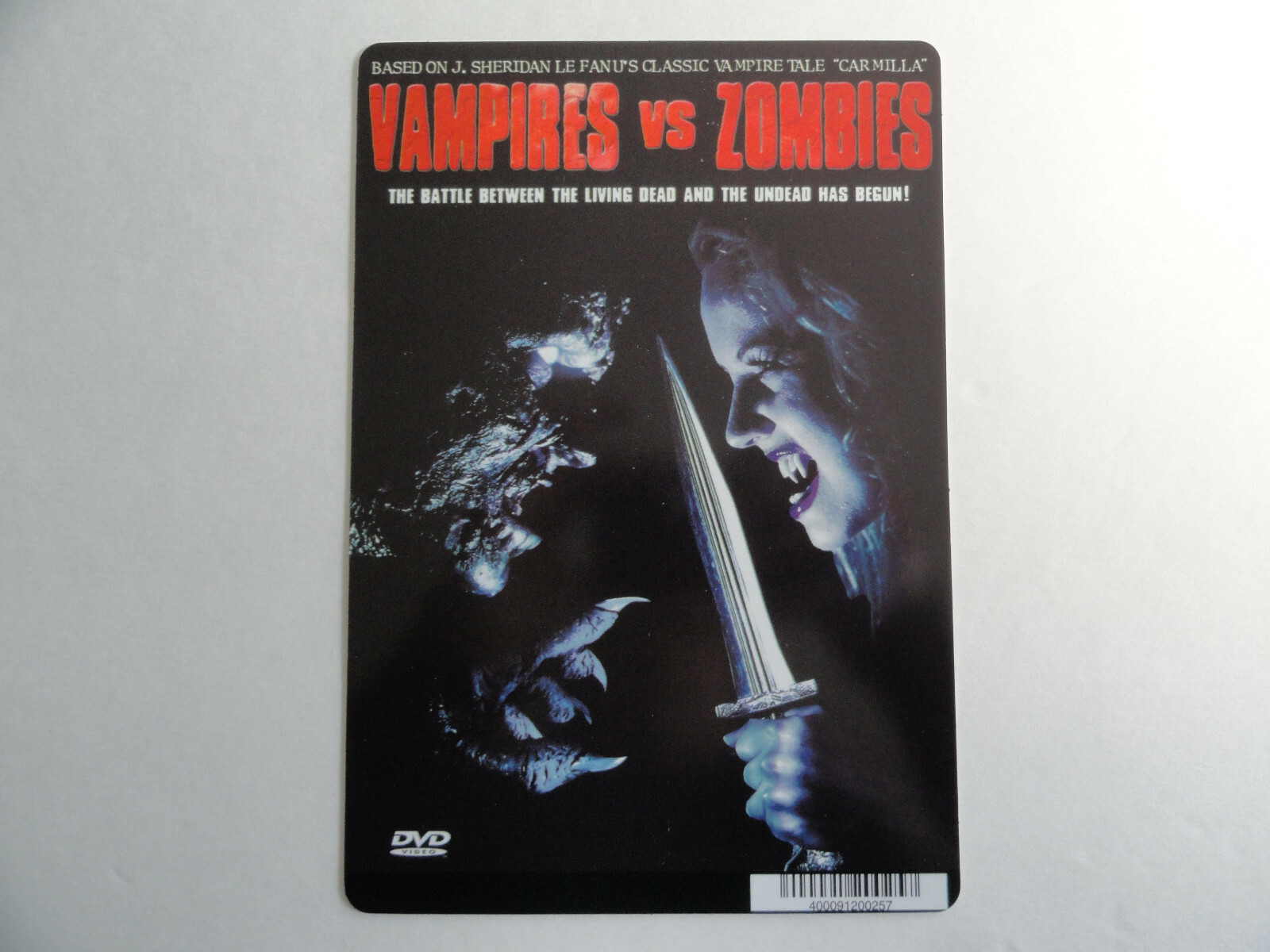 VAMPIRES VS ZOMBIES – J SHERIDAN LE FANU -BLOCKBUSTER BACKER CARD 5″X8″ NO MOVIE