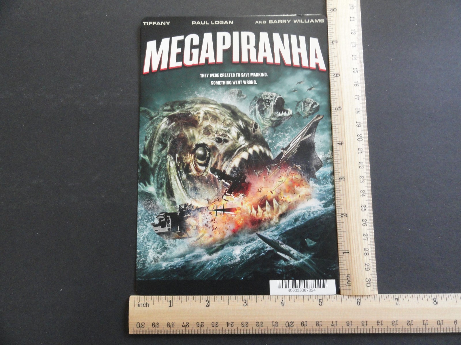 MEGAPIRANHA (TIFFANY, PAUL LOGAN) BLOCKBUSTER VIDEO BACKER CARD