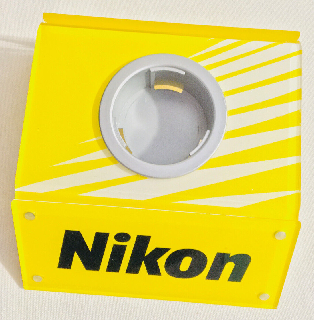 Vtg Nikon Camera lens Display Stand Yellow white back info card slot 5.5x5x1.5″