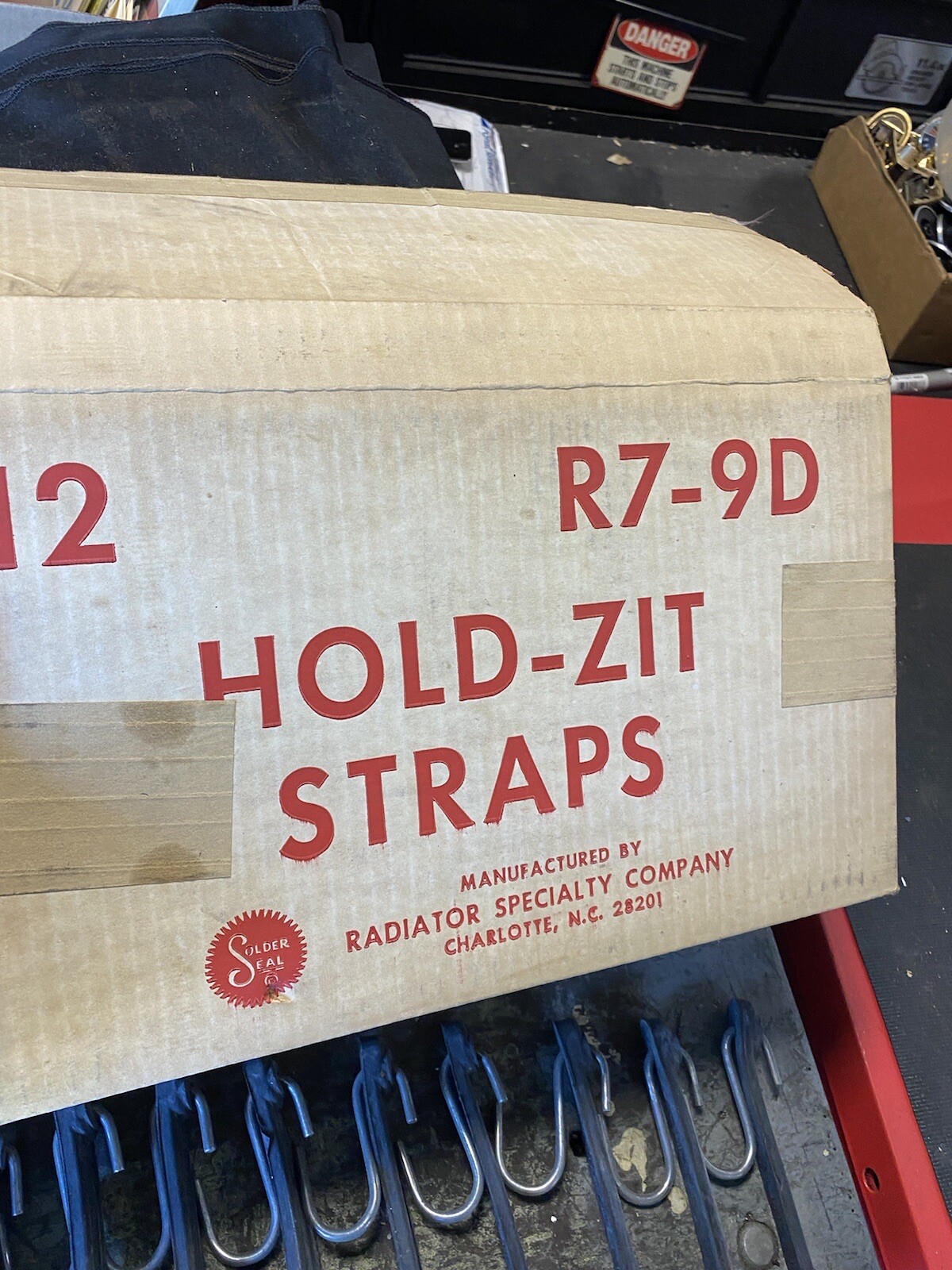 vintage advertising display hold zit straps NOS With Bungees (garage Oil Sign)