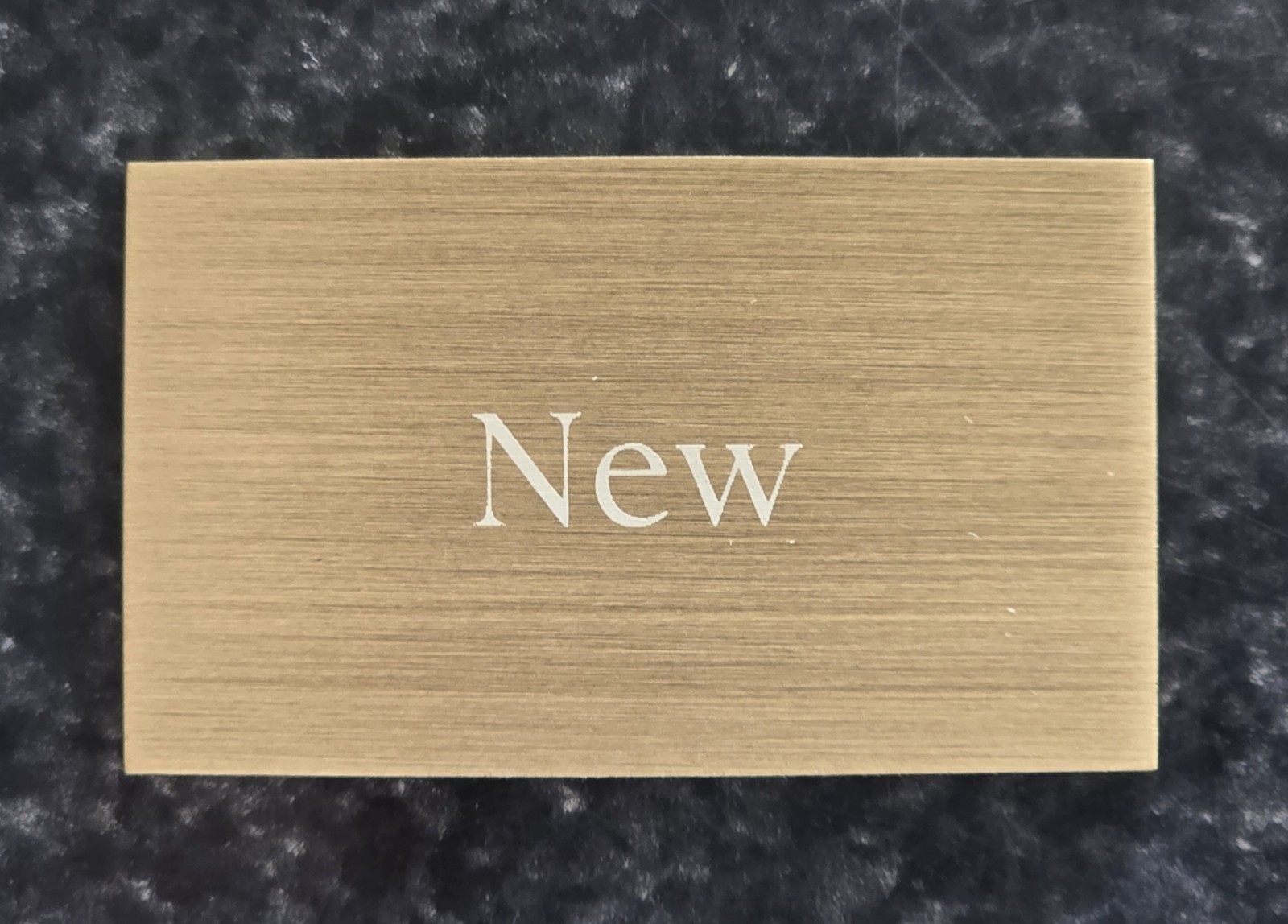 ORIGINAL PATEK PHILLIPE “NEW” DEALER’S BRASS PLAQUE BRAND NEW