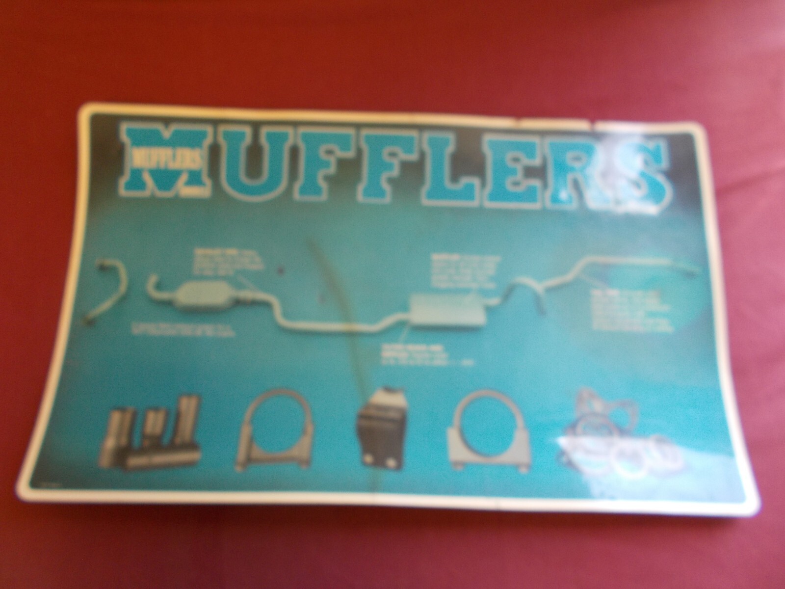 VINTAGE MERRIT MUFFLER COUNTER TOP MAT ADVERTIZING GAS OIL SIGN
