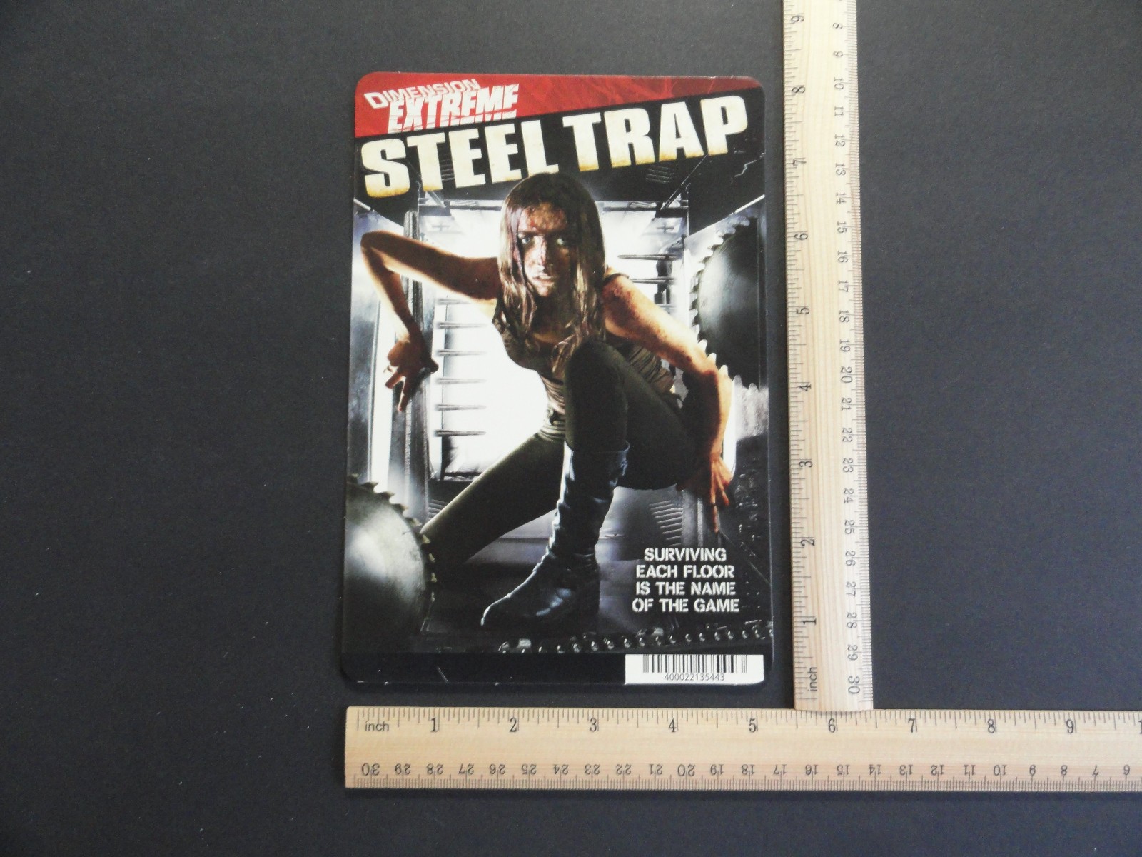 STEEL TRAP ( DIMENSION EXTREME ) BLOCKBUSTER VIDEO STORE BACKER CARD