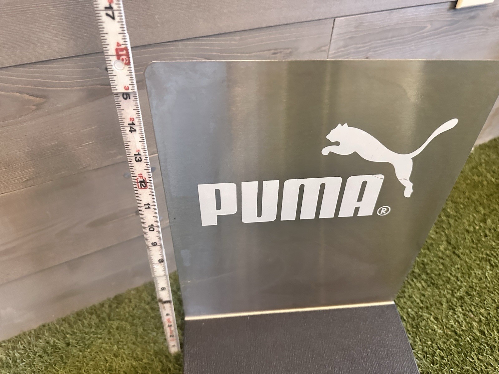 Stainless Steel Puma Shoe Display Advertisement