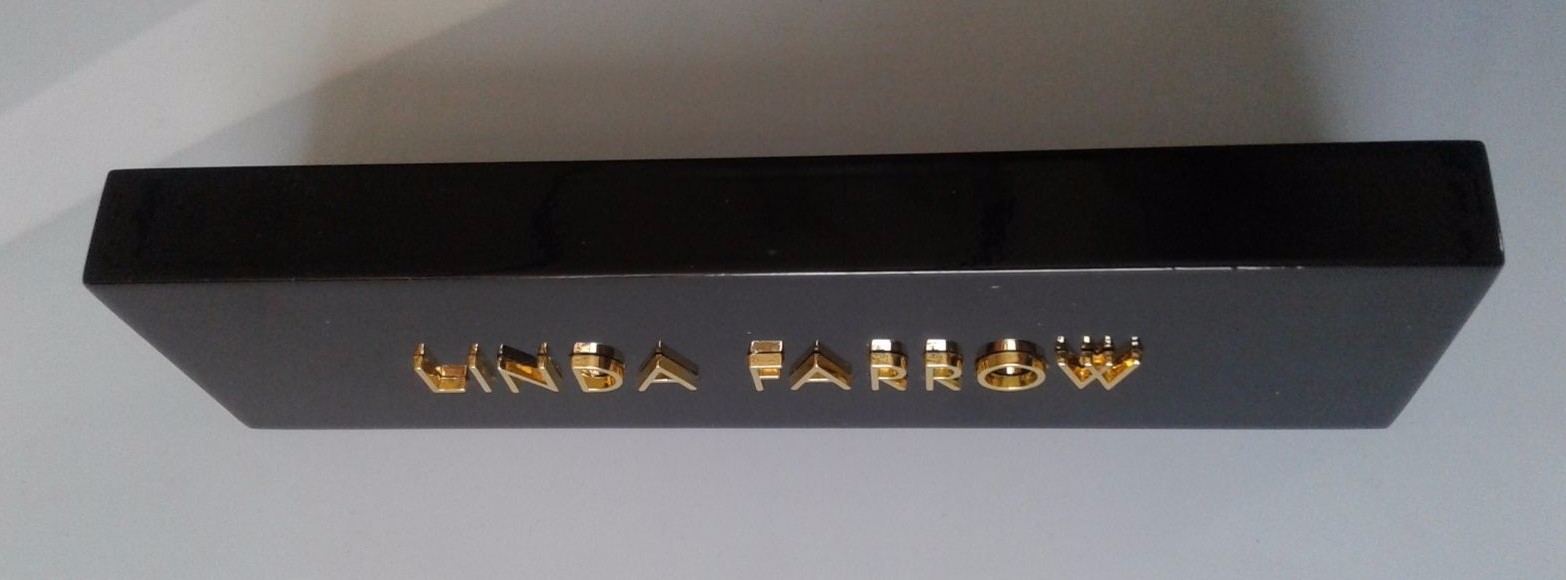 LINDA FARROW LOGO PLAQUE IN SHINY BLACK PLEXIGLASS