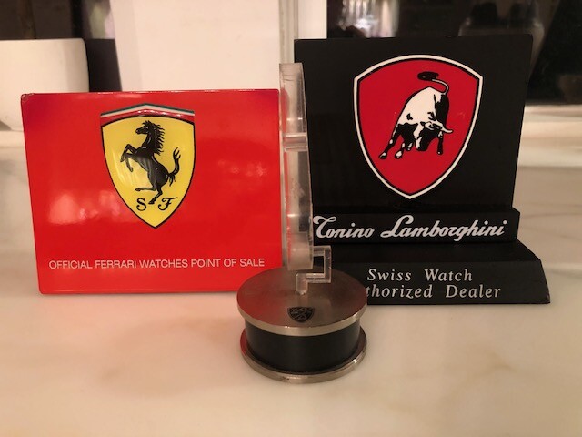 Ferrari Dealer Watch display with Extra Dealer sign and a Lamborghini sign
