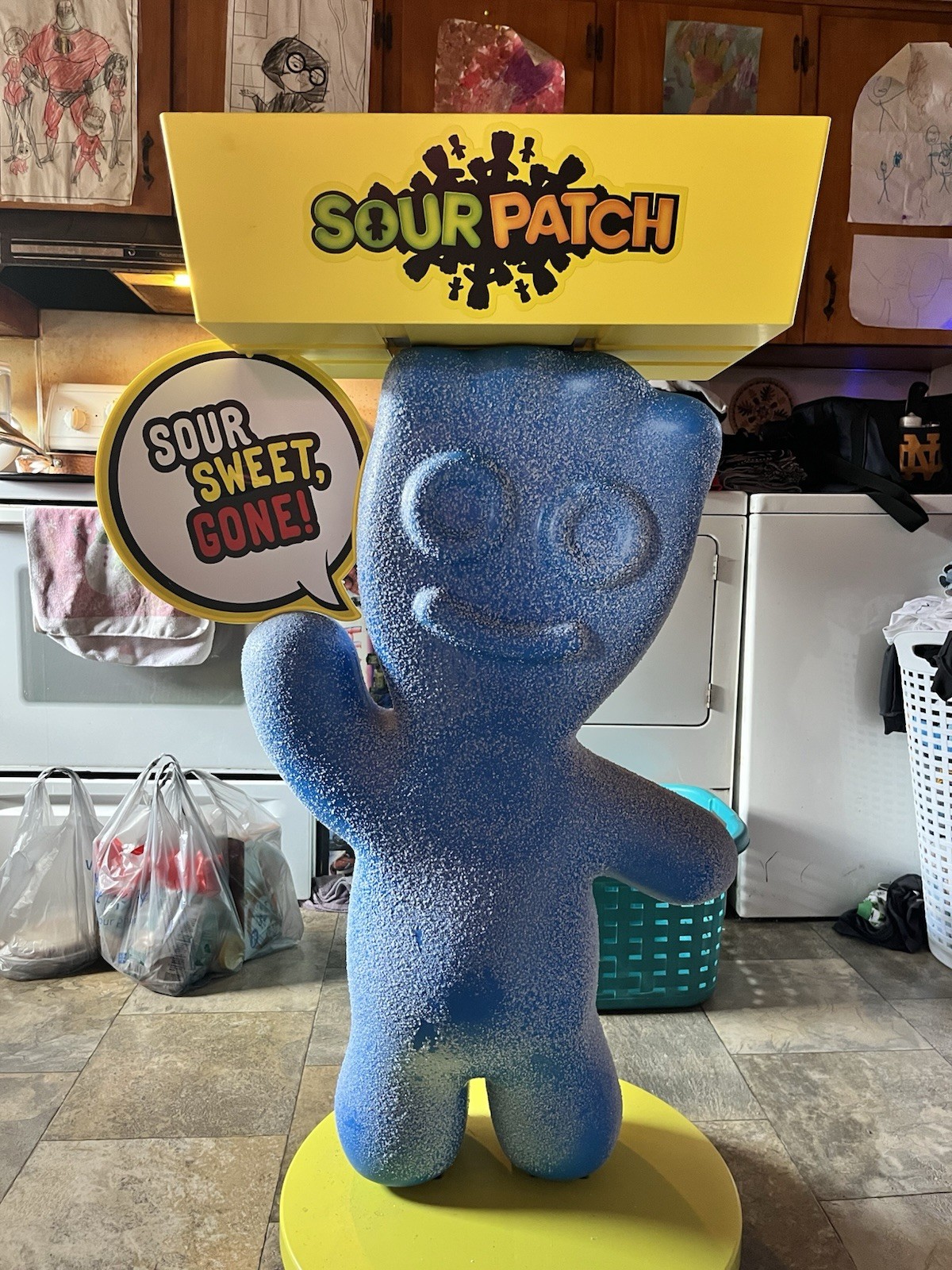Blue Sour Patch Store Display with ‘Sour Sweet Gone’ Sign, Yellow Base & Wheels