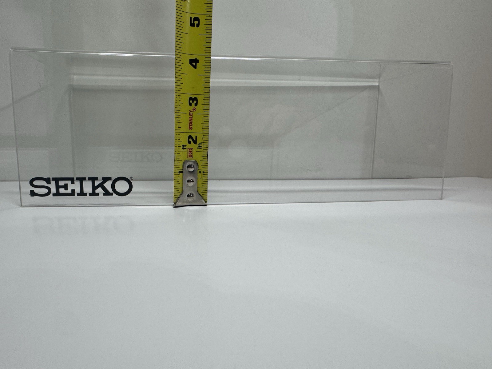 2x clear acrylic Seiko branded display holders
